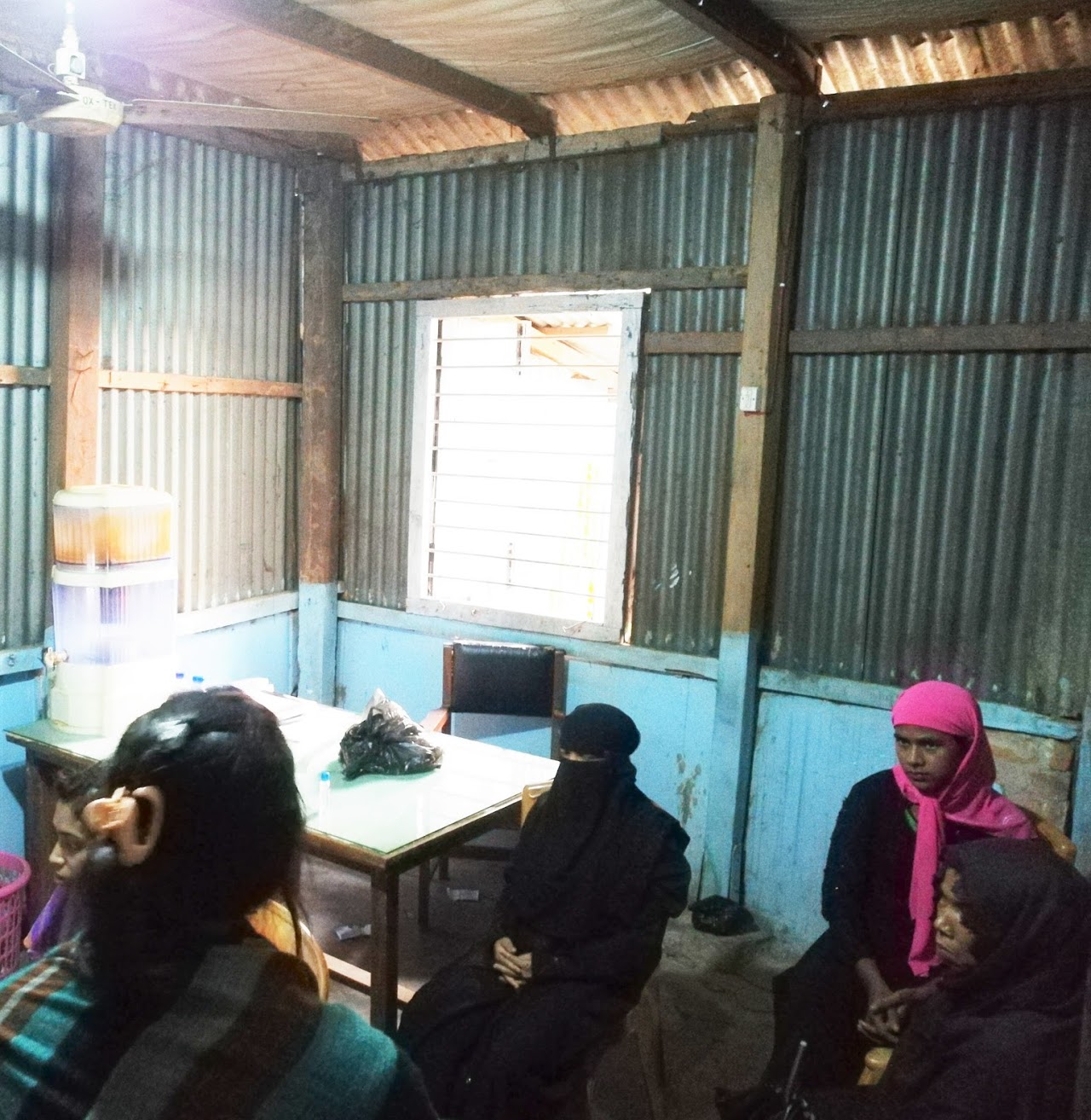 Some female Rohingya refugees are waiting in a room for interview in the camp area